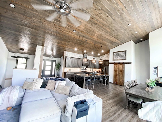 S7915 Ruthe Badger Ln, Merrimac, WI 53561 - living room featuring a ceiling fan, wood ceiling, wood finished floors, vaulted ceiling, and recessed lighting