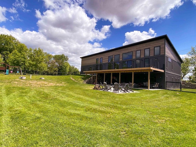 S7915 Ruthe Badger Ln, Merrimac, WI 53561 - rear view of house featuring a yard, a patio area, and an outdoor fire pit