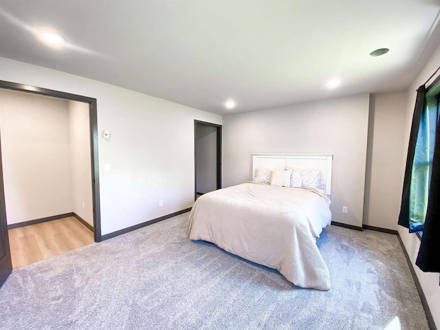 S7915 Ruthe Badger Ln, Merrimac, WI 53561 - bedroom featuring carpet, baseboards, and recessed lighting