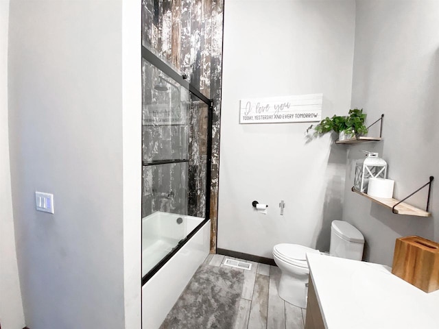 S7915 Ruthe Badger Ln, Merrimac, WI 53561 - bathroom with toilet, enclosed tub / shower combo, and vanity