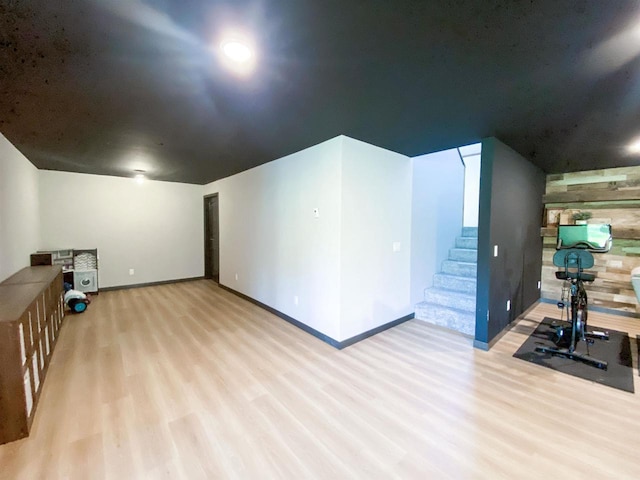 S7915 Ruthe Badger Ln, Merrimac, WI 53561 - additional living space with wood finished floors, stairs, and baseboards