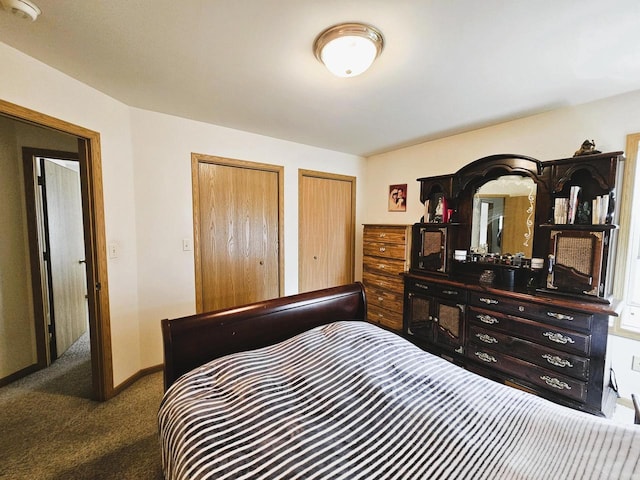 1114 W St, Racine, WI 53404 - bedroom with multiple closets, carpet, and baseboards