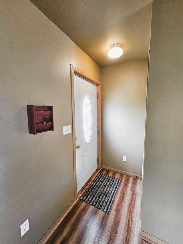 1114 W St, Racine, WI 53404 - foyer featuring wood finished floors and baseboards