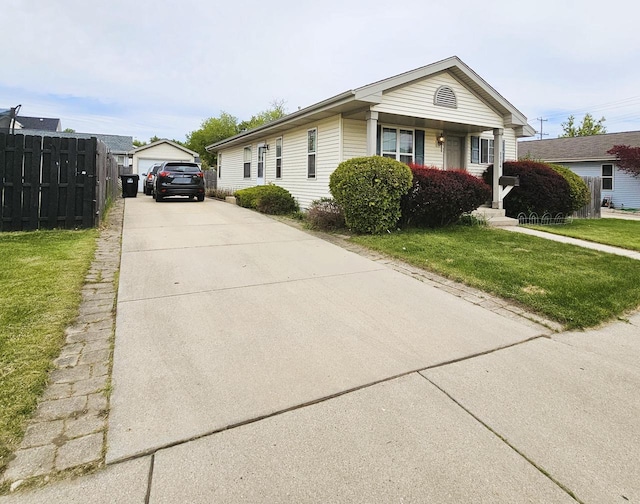 1114 W St, Racine, WI 53404 - view of front of property featuring an outbuilding and a detached garage