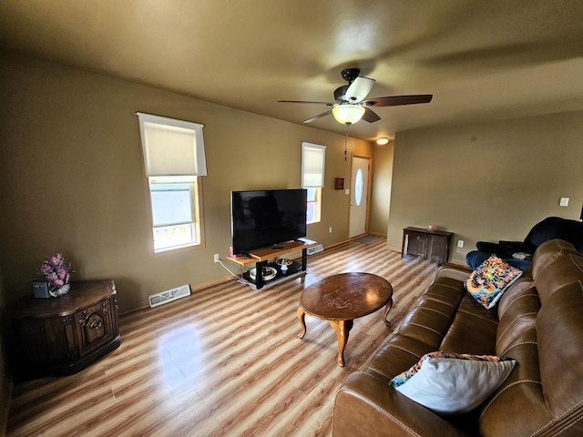 1114 W St, Racine, WI 53404 - living area featuring wood finished floors, ceiling fan, and baseboards