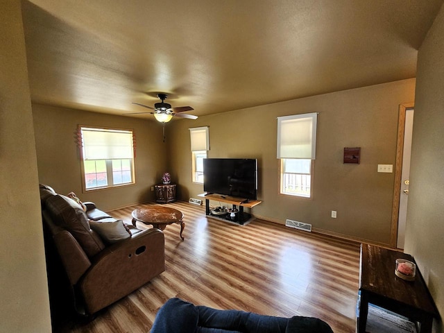 1114 W St, Racine, WI 53404 - living area with wood finished floors, ceiling fan, and baseboards
