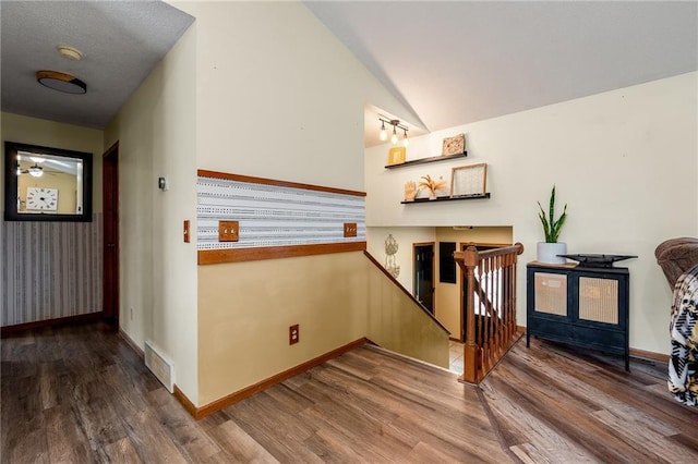 4868 183rd St, Chippewa Falls, WI 54729 - staircase with wood finished floors, baseboards, vaulted ceiling, and a ceiling fan