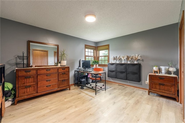 4868 183rd St, Chippewa Falls, WI 54729 - office with light wood-style floors, a textured ceiling, and baseboards