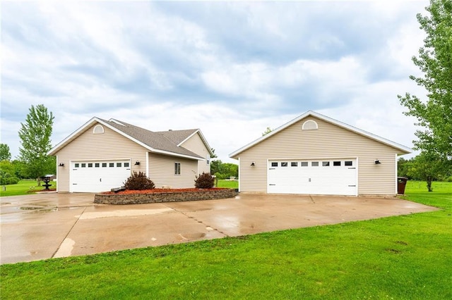 4868 183rd St, Chippewa Falls, WI 54729 - view of front of house with an outdoor structure, a front lawn, and a garage