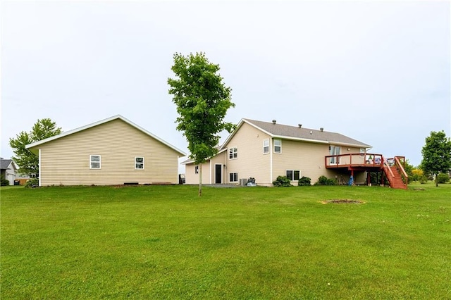 4868 183rd St, Chippewa Falls, WI 54729 - back of property with a deck, a yard, and stairs