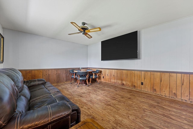 1517 Merry Ct, Port Washington, WI 53074 - living area with wood finished floors, ceiling fan, and wood walls