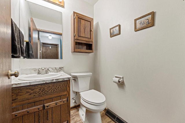 1517 Merry Ct, Port Washington, WI 53074 - half bath featuring vanity, toilet, and baseboards