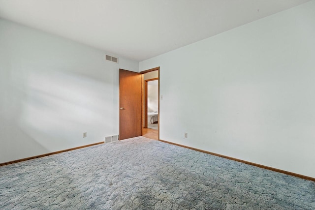 1517 Merry Ct, Port Washington, WI 53074 - spare room featuring baseboards and carpet flooring