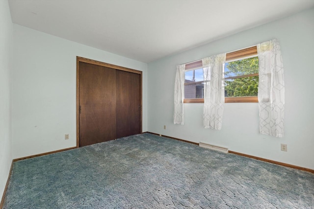 1517 Merry Ct, Port Washington, WI 53074 - unfurnished bedroom with baseboards, carpet, and a closet