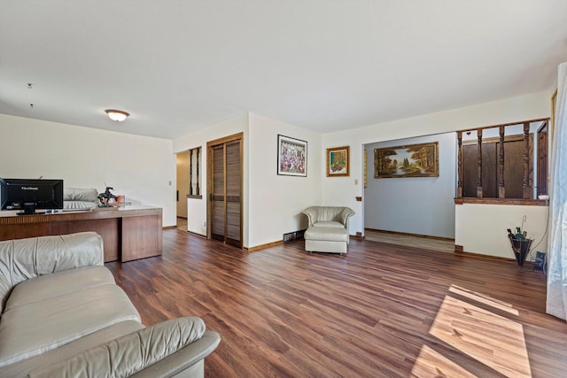 1517 Merry Ct, Port Washington, WI 53074 - living area featuring dark wood-type flooring, a desk, and baseboards