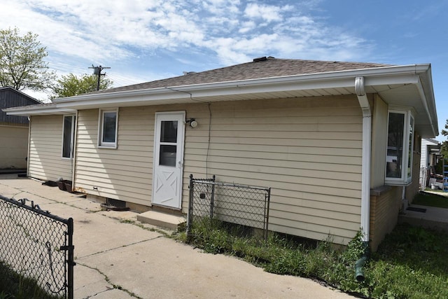 6655 N 78th St, Milwaukee, WI 53223 - rear view of house with a shingled roof and entry steps