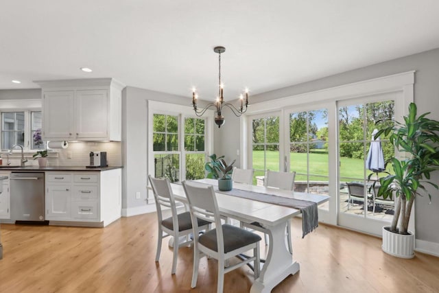 S36W27905 Robin Hill Cir, Waukesha, WI 53189 - dining room featuring a chandelier, light wood-style flooring, recessed lighting, and baseboards