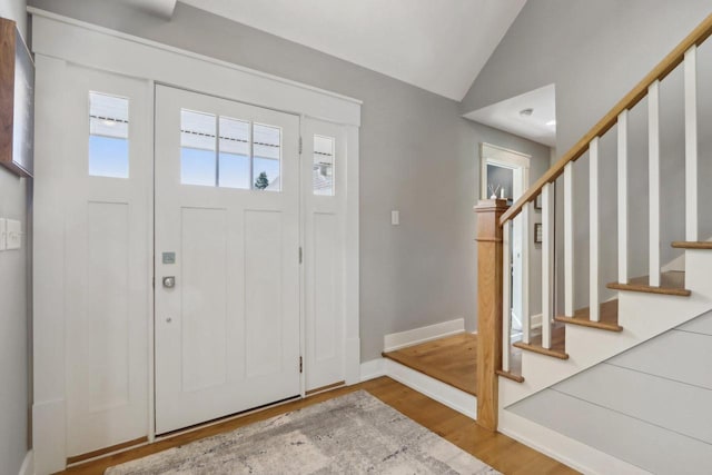 S36W27905 Robin Hill Cir, Waukesha, WI 53189 - entrance foyer featuring wood finished floors, stairs, lofted ceiling, and baseboards
