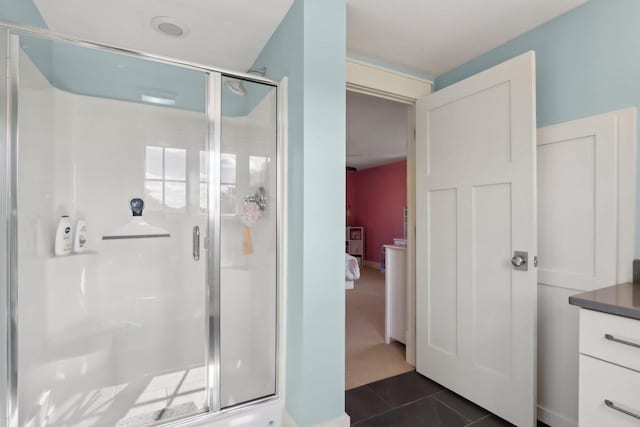 S36W27905 Robin Hill Cir, Waukesha, WI 53189 - bathroom featuring a stall shower, tile patterned flooring, and ensuite bath