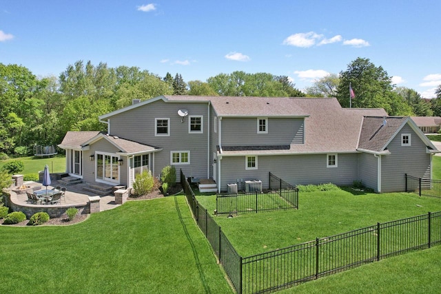 S36W27905 Robin Hill Cir, Waukesha, WI 53189 - back of house with a patio, an outdoor fire pit, a shingled roof, central AC unit, and entry steps