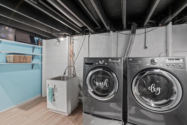 1017 S 120th St, West Allis, WI 53214 - laundry room featuring separate washer and dryer and light wood finished floors