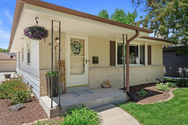 1017 S 120th St, West Allis, WI 53214 - view of front of property with brick siding and a porch