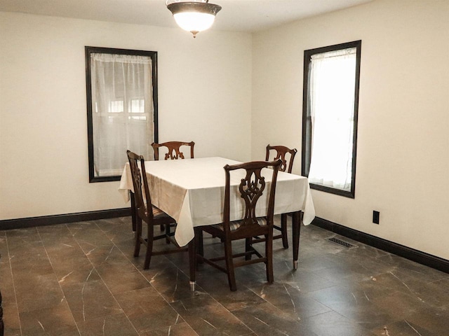 507 Janesville St, Oregon, WI 53575 - dining space featuring baseboards