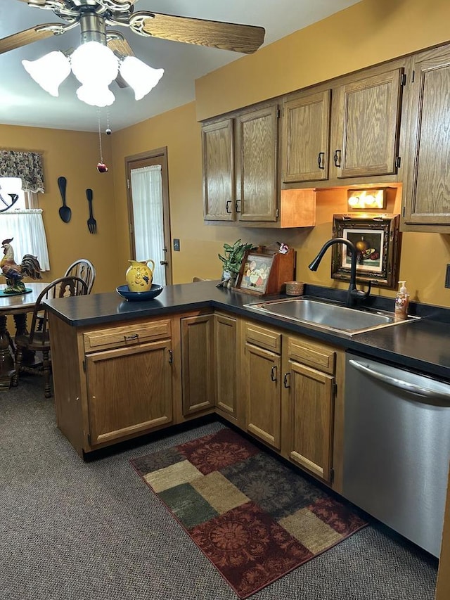 4103 80th St Unit 28A, Kenosha, WI 53142 - kitchen featuring stainless steel dishwasher, dark colored carpet, a peninsula, a sink, and dark countertops