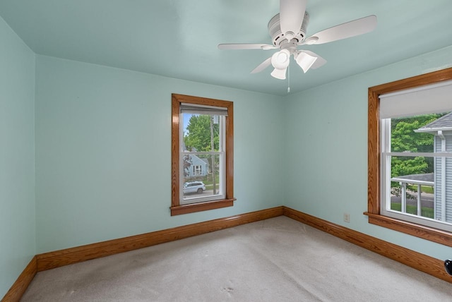 210 Gilmore Ave, Beaver Dam, WI 53916 - carpeted empty room featuring baseboards and a ceiling fan