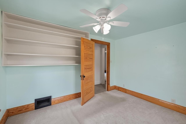 210 Gilmore Ave, Beaver Dam, WI 53916 - unfurnished bedroom featuring carpet flooring, baseboards, and ceiling fan