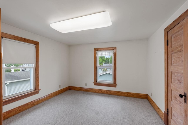 210 Gilmore Ave, Beaver Dam, WI 53916 - spare room featuring carpet floors and baseboards