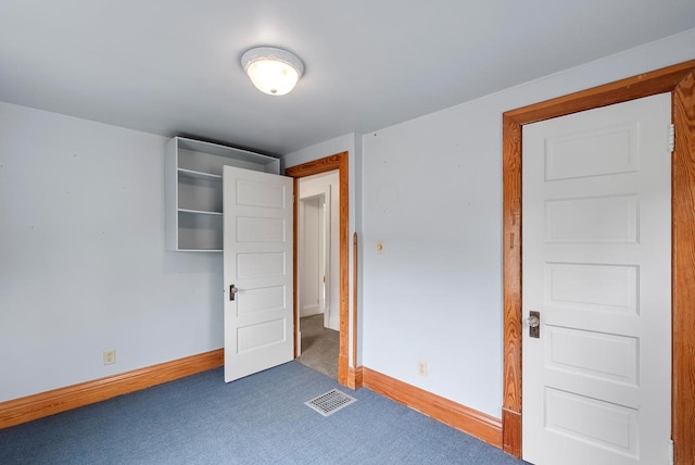 210 Gilmore Ave, Beaver Dam, WI 53916 - unfurnished bedroom featuring baseboards and carpet floors