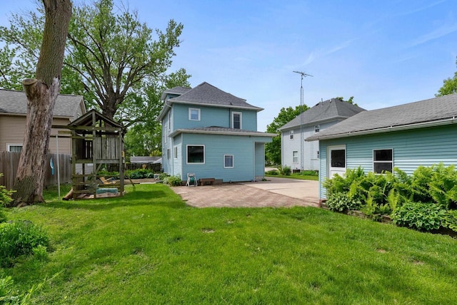 210 Gilmore Ave, Beaver Dam, WI 53916 - back of house featuring a patio