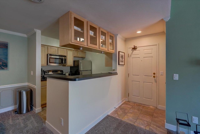 2 Captains Ct Unit 5, Madison, WI 53719 - kitchen with stainless steel appliances, crown molding, glass insert cabinets, dark countertops, and baseboards
