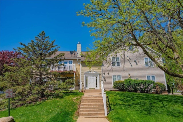 2 Captains Ct Unit 5, Madison, WI 53719 - view of front of property with a front lawn, a chimney, and a balcony
