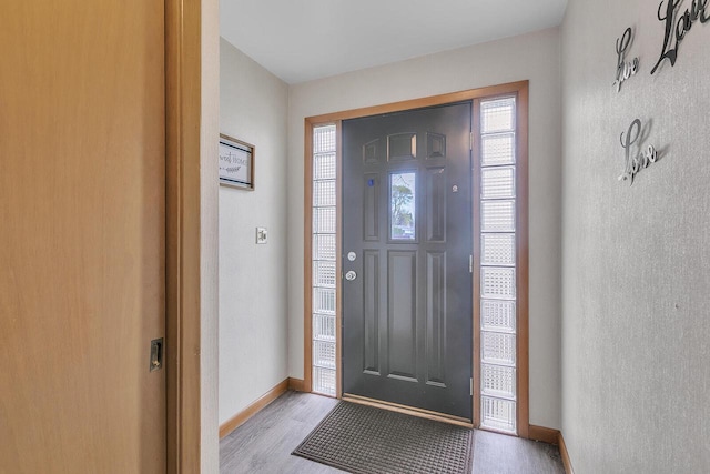 2117 N 27th St, Sheboygan, WI 53081 - entrance foyer with baseboards and light wood-type flooring