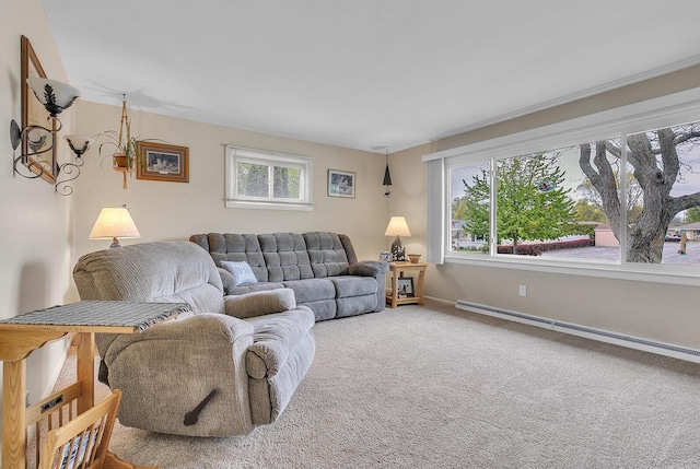 2117 N 27th St, Sheboygan, WI 53081 - carpeted living room with a baseboard heating unit, plenty of natural light, and baseboards