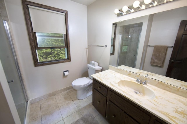 6538 N Bethmaur Ln, Glendale, WI 53209 - full bath featuring a stall shower, vanity, toilet, baseboards, and tile patterned floors
