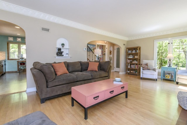 5744 W Rita Dr, West Allis, WI 53219 - living room featuring arched walkways, light wood-style flooring, stairs, and baseboards