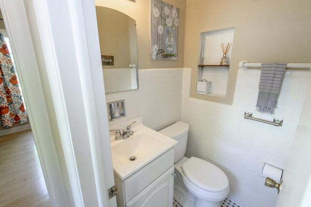 5744 W Rita Dr, West Allis, WI 53219 - bathroom with tile walls, toilet, and vanity