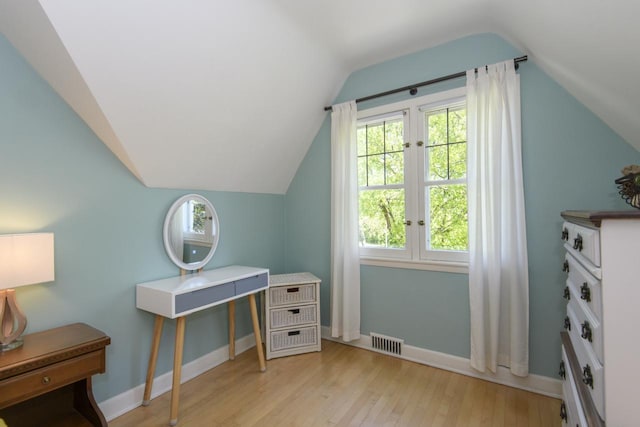 5744 W Rita Dr, West Allis, WI 53219 - additional living space with wood finished floors, lofted ceiling, and baseboards
