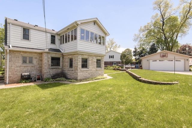 5744 W Rita Dr, West Allis, WI 53219 - rear view of property with stone siding, a garage, an outdoor structure, and a lawn