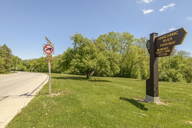 5744 W Rita Dr, West Allis, WI 53219 - view of asphalt street featuring traffic signs