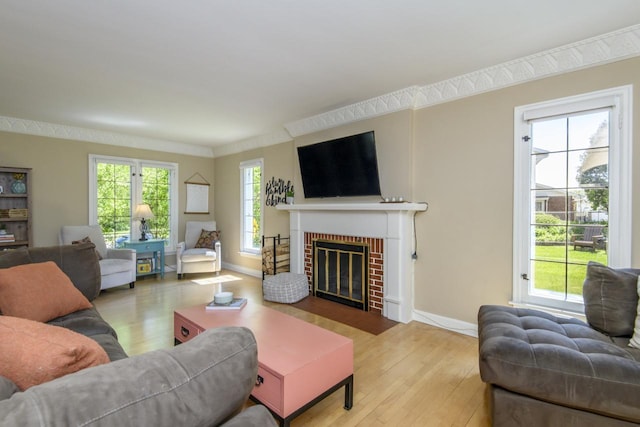 5744 W Rita Dr, West Allis, WI 53219 - living area with wood finished floors, a fireplace, baseboards, and crown molding