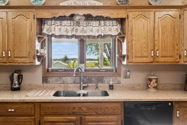 W7211 Pine Rd, Thorp, WI 54771 - kitchen featuring dishwasher, a sink, and light countertops