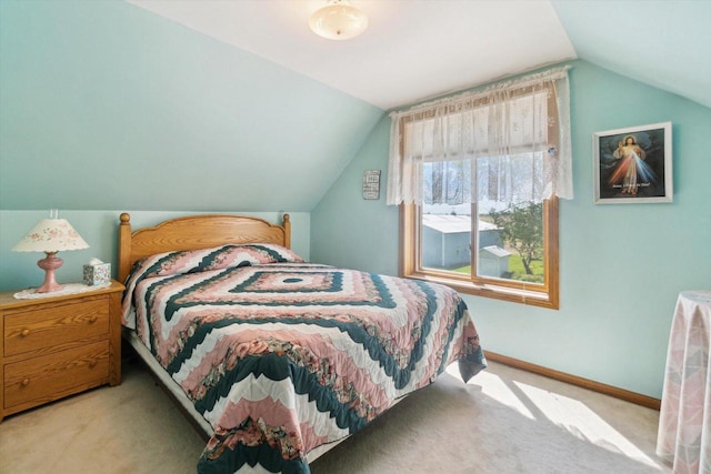 W7211 Pine Rd, Thorp, WI 54771 - bedroom featuring vaulted ceiling, carpet flooring, and baseboards