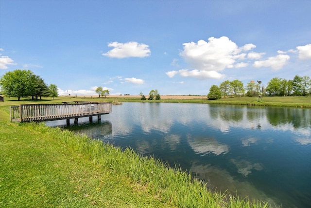 W7211 Pine Rd, Thorp, WI 54771 - dock area with a water view and a lawn