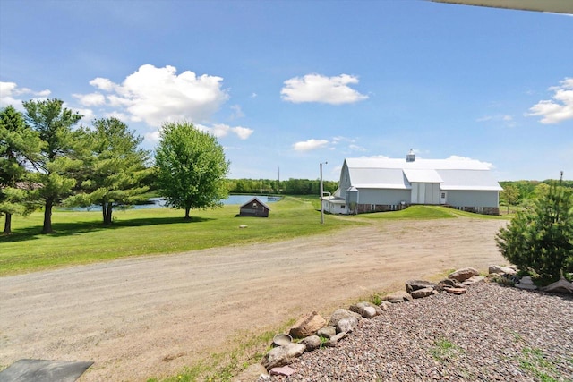 W7211 Pine Rd, Thorp, WI 54771 - view of green lawn featuring a water view