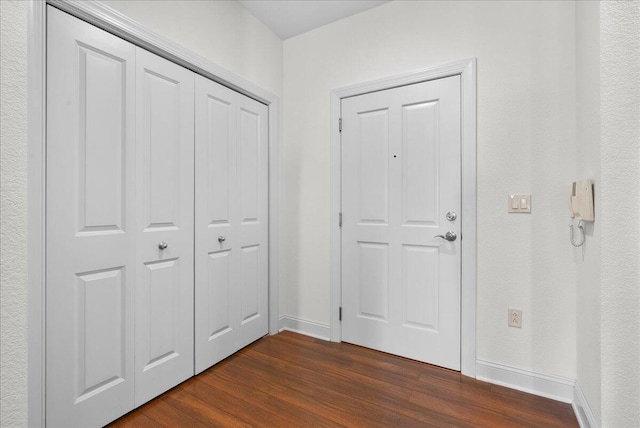 832 N 6th St Unit 118, Sheboygan, WI 53081 - foyer entrance with baseboards and dark wood finished floors