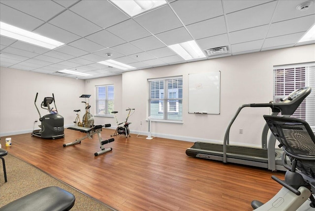 832 N 6th St Unit 118, Sheboygan, WI 53081 - exercise room with wood finished floors, a drop ceiling, and baseboards